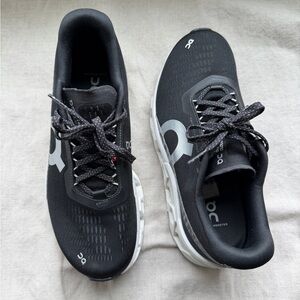 On Running Women’s Black and White Cloudmonster Sneakers